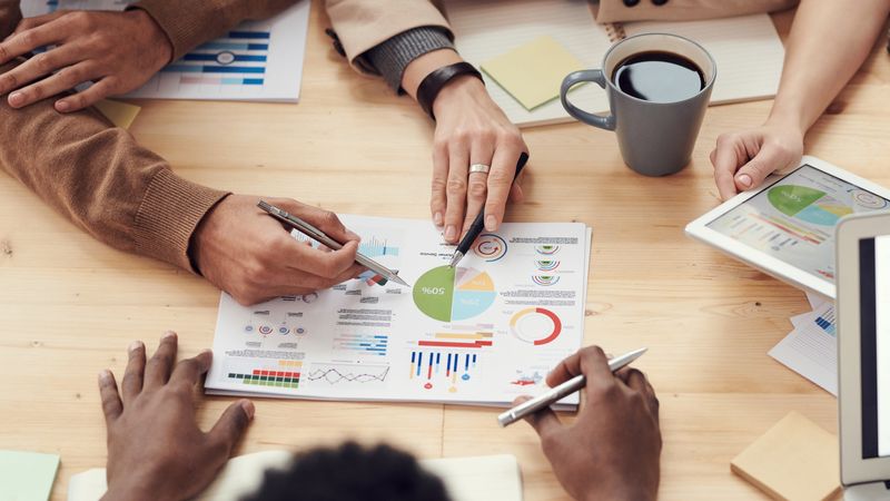Business professionals reviewing documents together