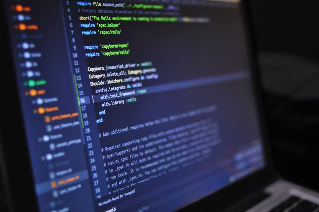 Web development workspace with code on screen